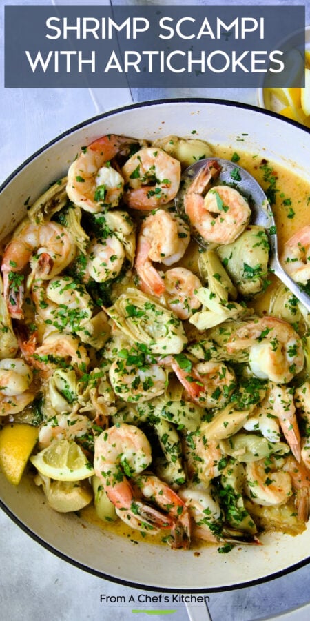 Pinterest graphic for Shrimp Scampi with Artichokes showing it in a white enamel cast iron skillet with metal spoon.