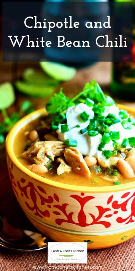 Pinterest graphic for Chipotle and White Bean Chili showing it in a red and yellow bowl garnished with sour cream and cilantro.