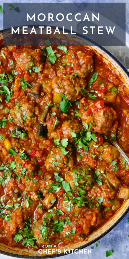 Pinterest graphic for Moroccan Meatball Stew showing it in a white enamel cast iron skillet with serving spoon.