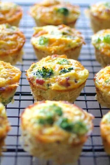 Twelve Spaghetti Squash Broccoli Bacon and Cheddar Mini Quiches on cooling rack.
