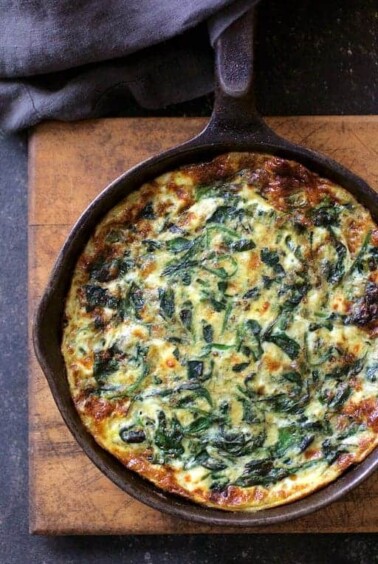 Spinach Leek and Feta Cheese Frittata in cast iron skillet.