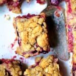 Rectangular pieces of Blueberry Crumble Bars with ornate server.