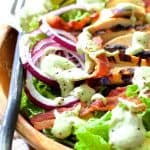 Chicken BLT Salad with Spicy Avocado Ranch Dressing in wood bowl.