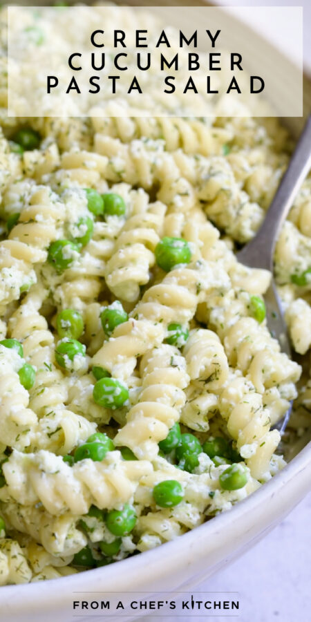 Pinterest graphic for Creamy Cucumber Pasta Salad showing it in a white serving bowl with serving spoon.