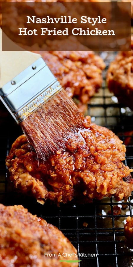 Pinterest graphic for Nashville Style Hot Fried Chicken showing a pastry brush brushing hot sauce over a piece on a cooling rack.