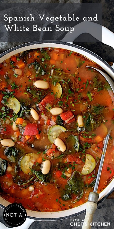 Pinterest graphic for Spanish Vegetable and White Bean Soup showing it in a white Dutch oven with soup ladle.