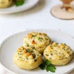 Three Lemon Parmesan Stuffed Artichoke Bottoms on white plate.