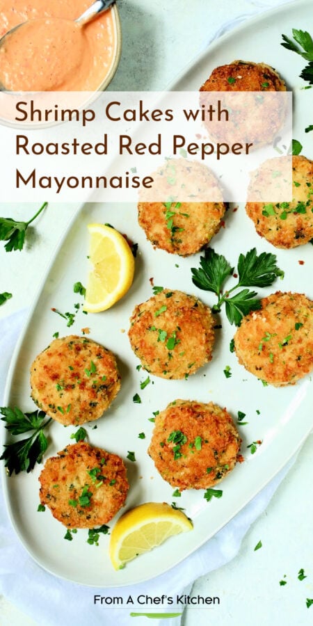 Pinterest graphic for Shrimp Cakes with Roasted Red Pepper Mayonnaise showing the cakes on an oval white platter.