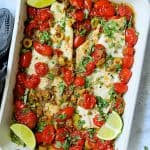 Baked Veracruz-Style Fish in white rectangular baking dish.