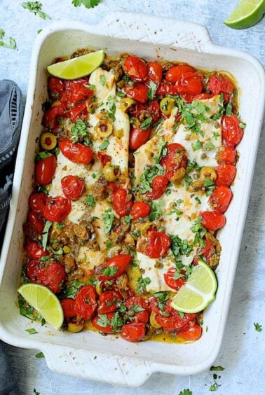 Baked Veracruz-Style Fish in white rectangular baking dish.