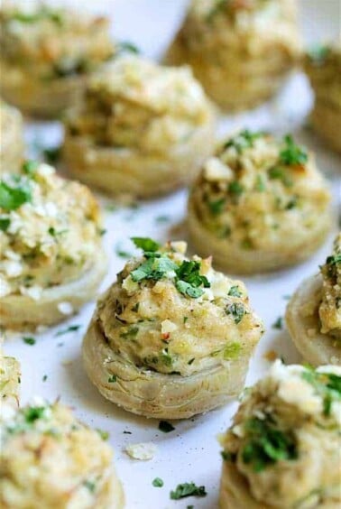 Deviled Crab Stuffed Artichoke Bottoms on white platter.