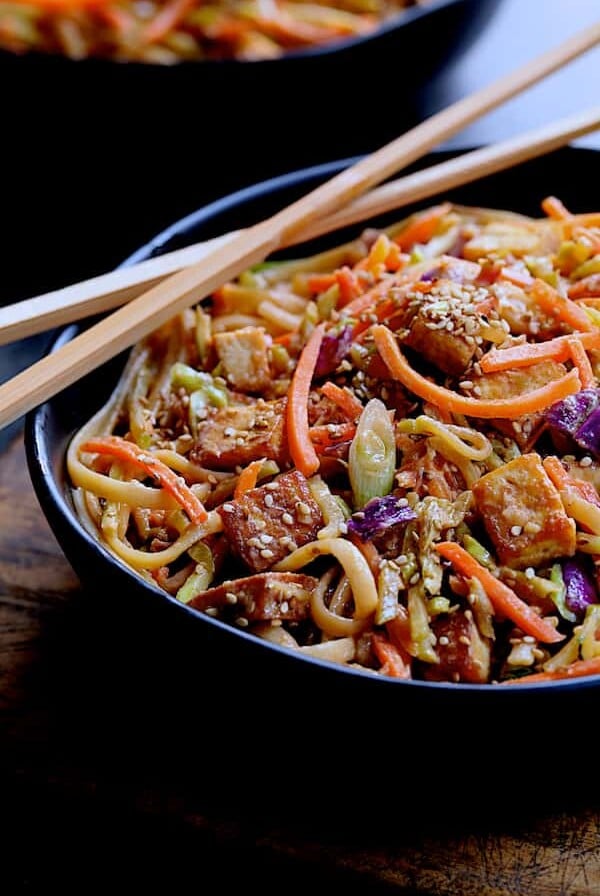 Thai Sesame Noodles with Tofu and Vegetables - Close-up shot of noodle dish in black bowl