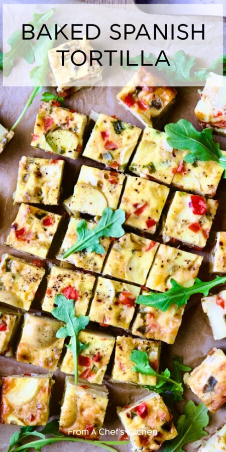 Pinterest graphic for Baked Spanish Tortilla showing it cut into small squares on wood cutting board.