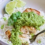 Piece of Mahi-Mahi with Cilantro - Ginger Pesto on a fork.