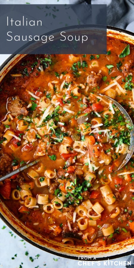 Pinterest graphic for Italian Sausage Soup showing it in a white Dutch oven with soup ladle.