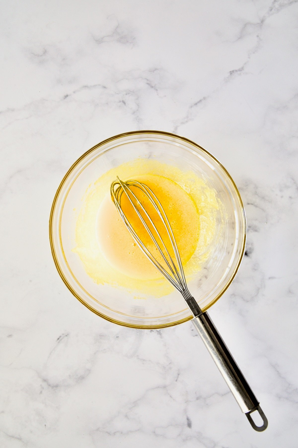 Whisk in the process of beating egg whites and sugar together.