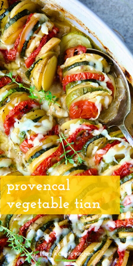 Pinterest graphic for Provencal Vegetable Tian showing it in a white baking dish with serving spoon.