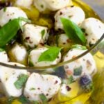 Marinated Mozzarella Balls in glass jar.