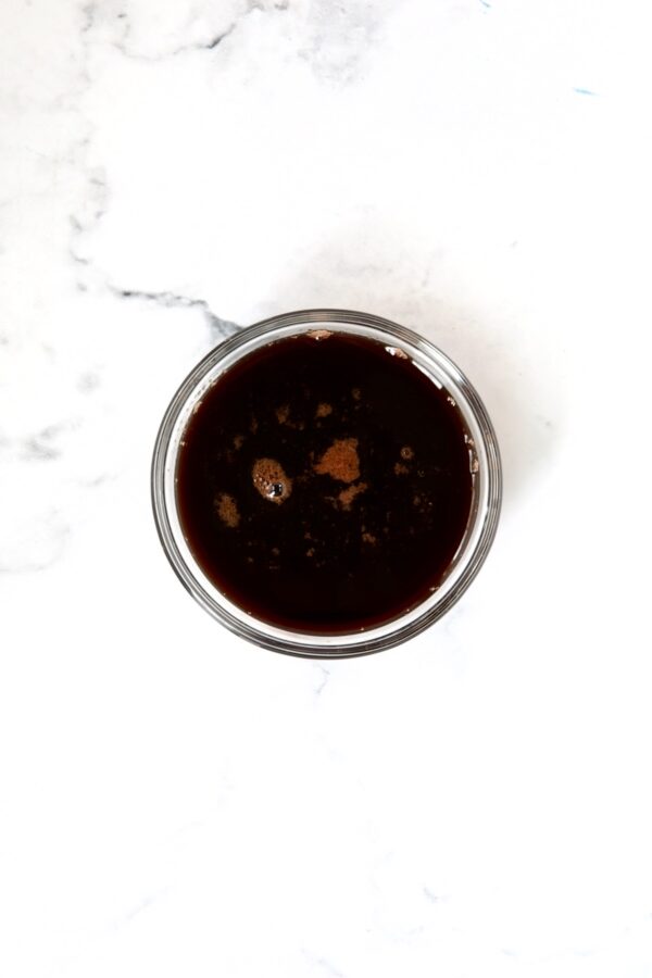 Red wine glaze in glass bowl.