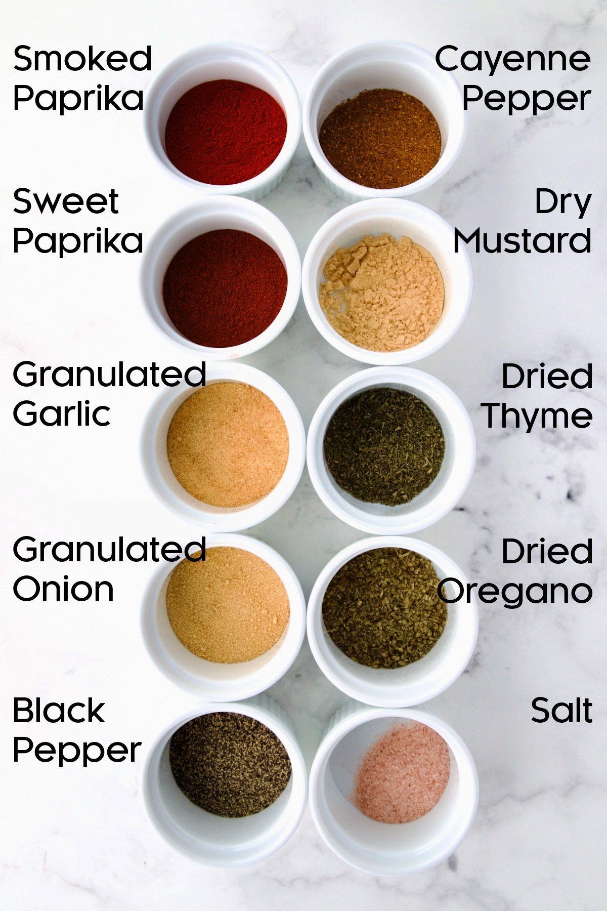 Ingredients for Blackening Seasoning in white ramekins.