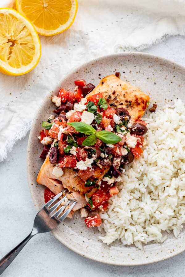 Salmon with Mediterranean Salsa on plate with rice.