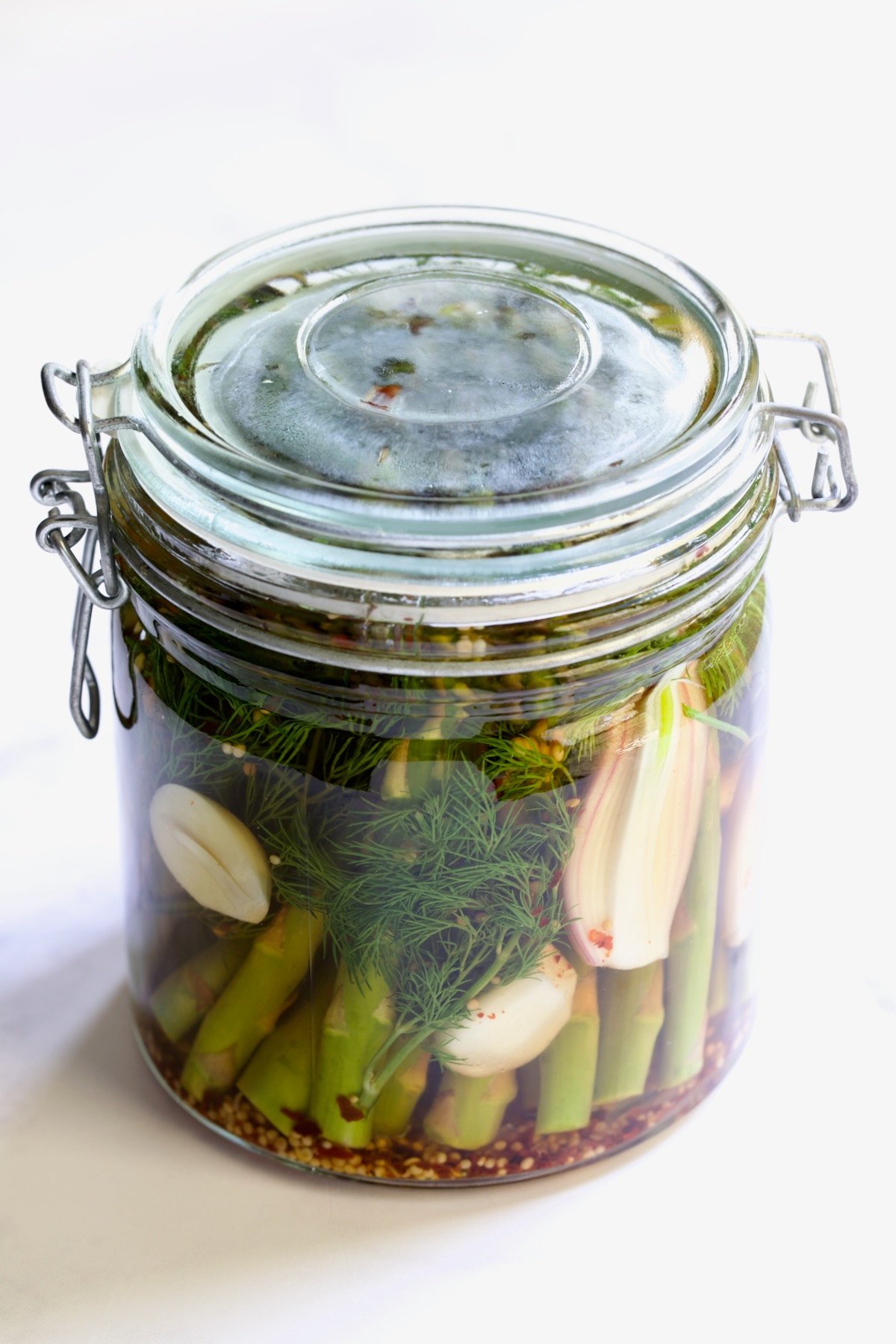 Asparagus in glass jar with top securely in place.