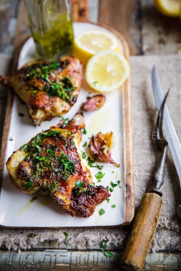 Italian Baked Chicken on rectangular white platter.