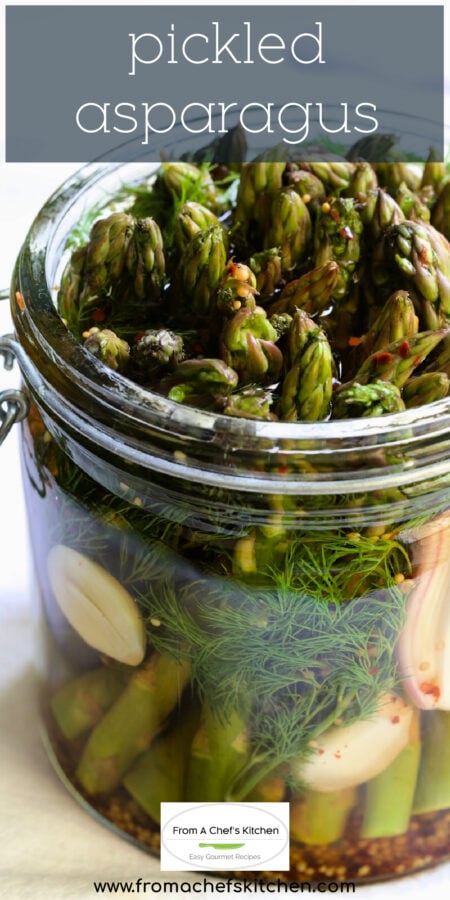 Pinterest graphic for Pickled Asparagus showing it in a glass jar.
