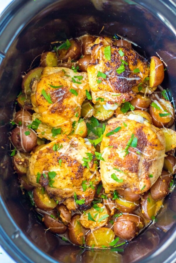 Four Garlic Parmesan Chicken Thighs in slow cooker.