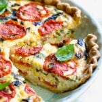 Tomato Pie Recipe with Corn and Basil with the focus on one piece.