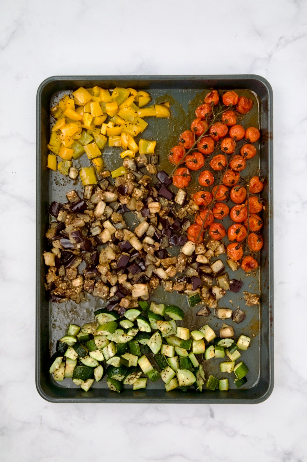 Vegetables for galette on rimmed sheet pan after being roasted.