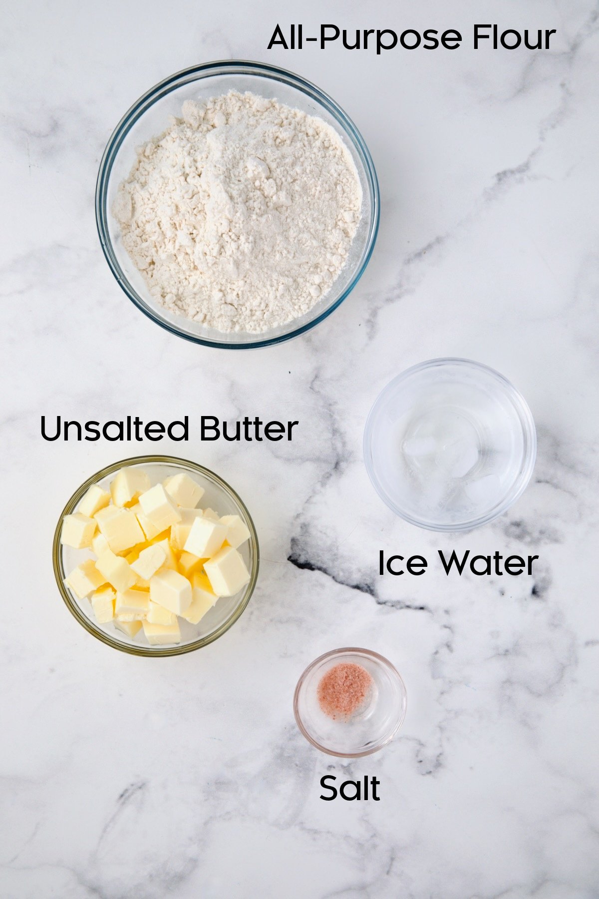 Ingredients for pastry dough in glass bowls.
