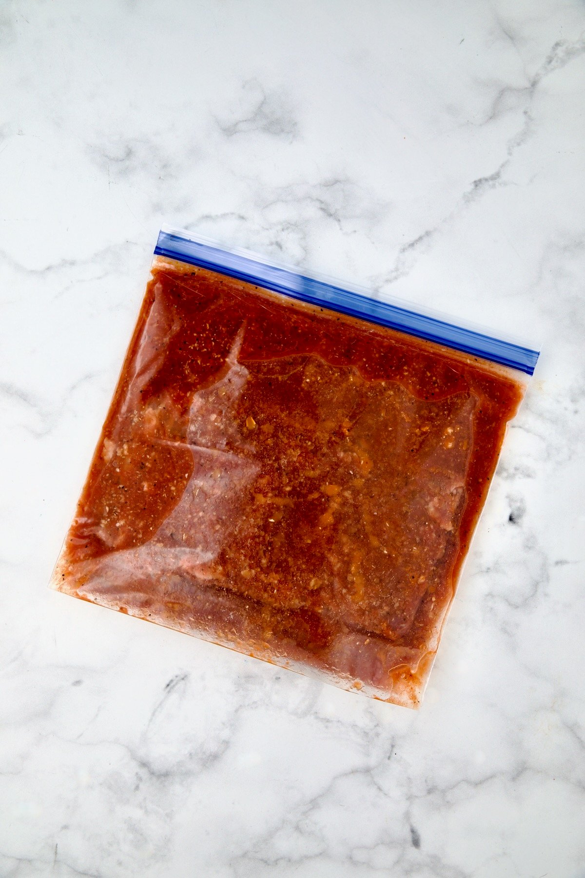Bloody Mary marinade and skirt steak in gallon-size zipper-top bag.