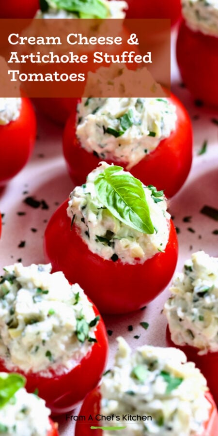 Pinterest graphic for Cream Cheese and Artichoke Stuffed Tomatoes showing them garnished with small fresh basil leaves.