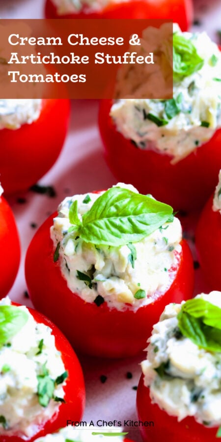 Pinterest graphic for Cream Cheese and Artichoke Stuffed Tomatoes showing them garnished with small fresh basil leaves.