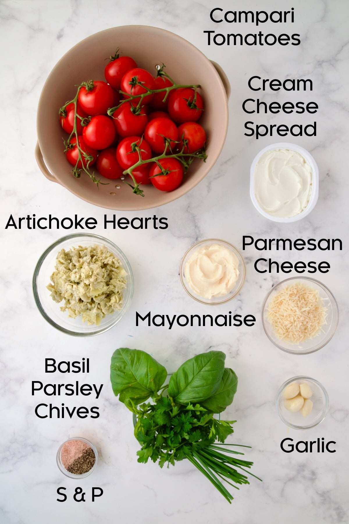 Ingredients for Cream Cheese and Artichoke Stuffed Tomatoes in glass bowls.