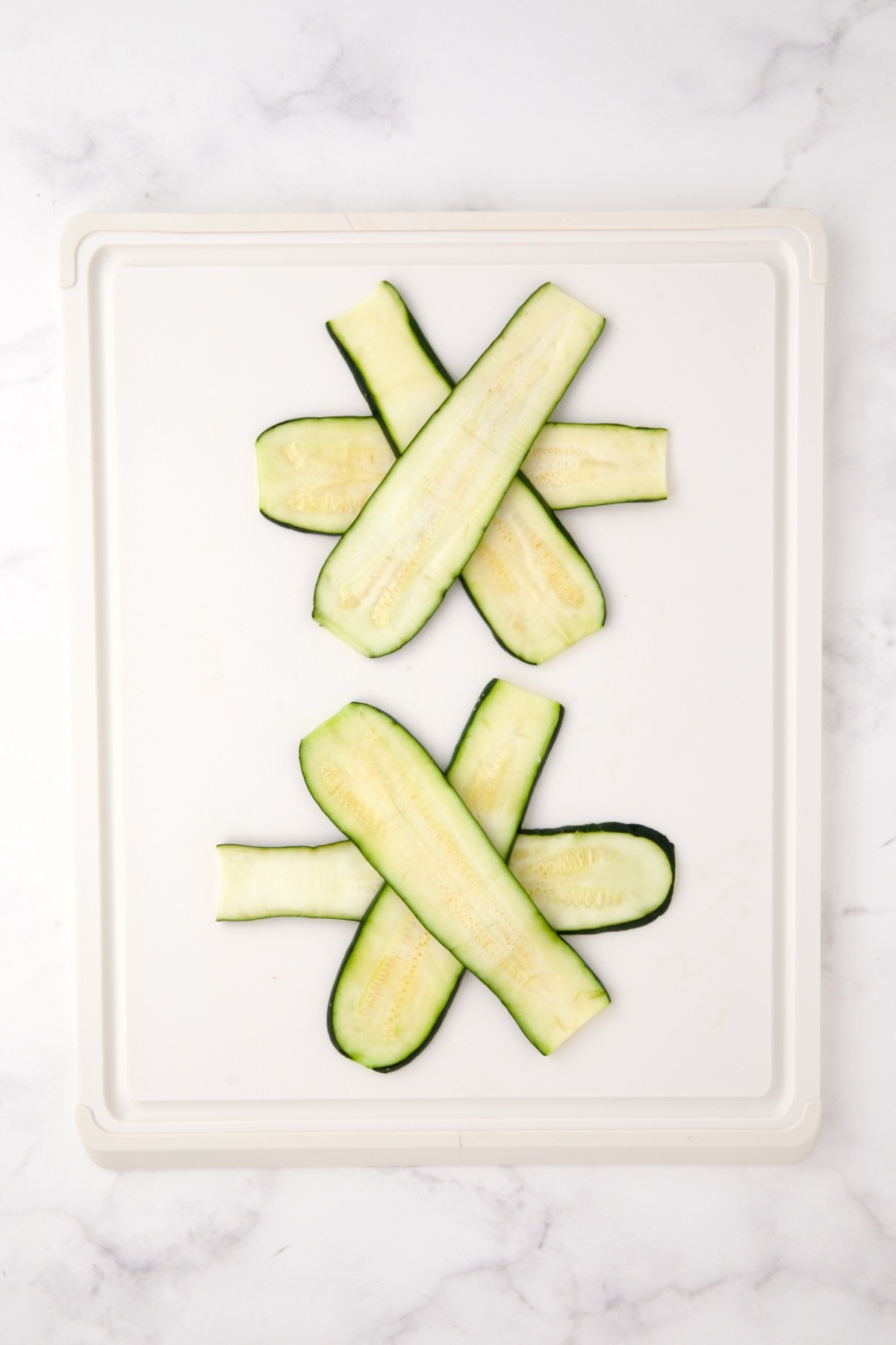 Two sets of zucchini slices in a star pattern.