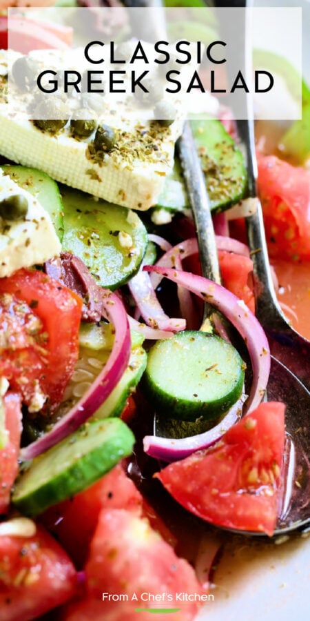 Pinterest graphic for Classic Greek Salad showing it on an oval white platter.