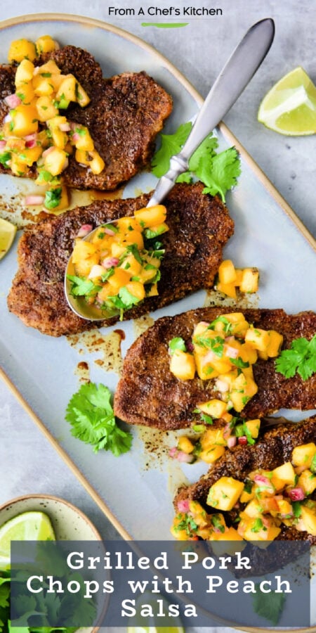 Pinterest graphic for Grilled Pork Chops with Peach Salsa showing them on a gray oval platter with spoon.