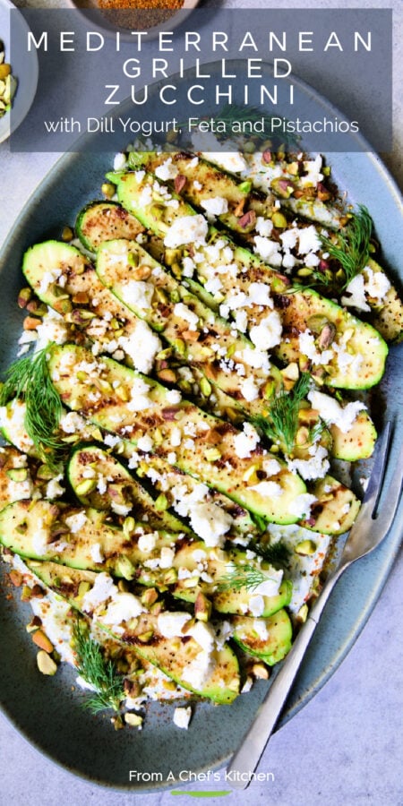 Pinterest graphic for Mediterranean Grilled Zucchini with Dill Yogurt and Feta showing it on a blue oval platter with serving fork.