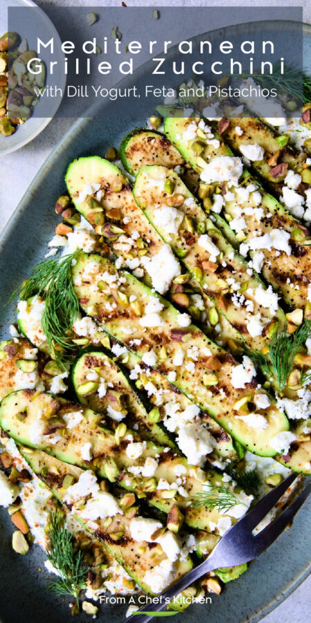 Pinterest graphic for Mediterranean Grilled Zucchini with Dill Yogurt and Feta showing it on a blue oval platter with serving fork.
