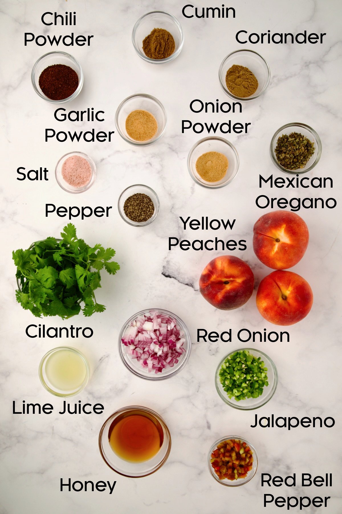 Ingredients for Pork Chops with Peach Salsa in glass bowls.