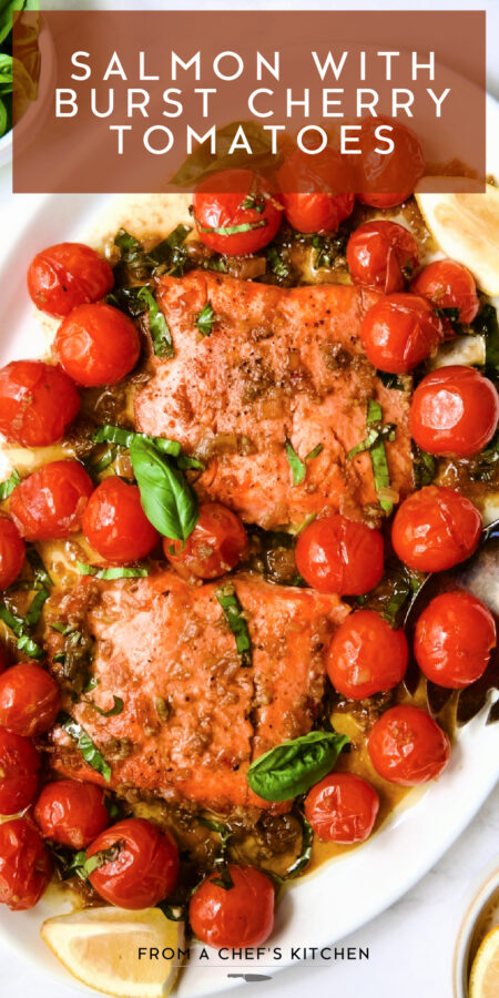 Pinterest graphic for Salmon with Cherry Tomatoes showing it on an oval white platter with basil and lemon wedges.