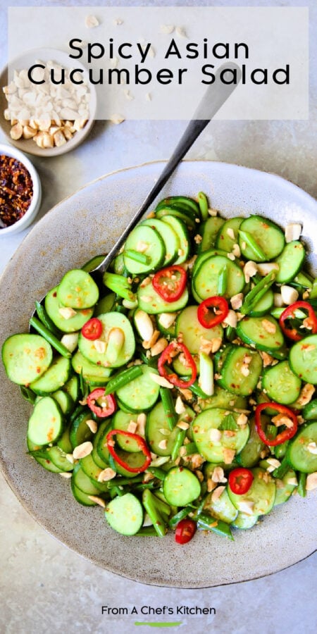 Pinterest graphic for Spicy Asian Cucumber Salad showing it in an earthenware bowl with serving spoon.