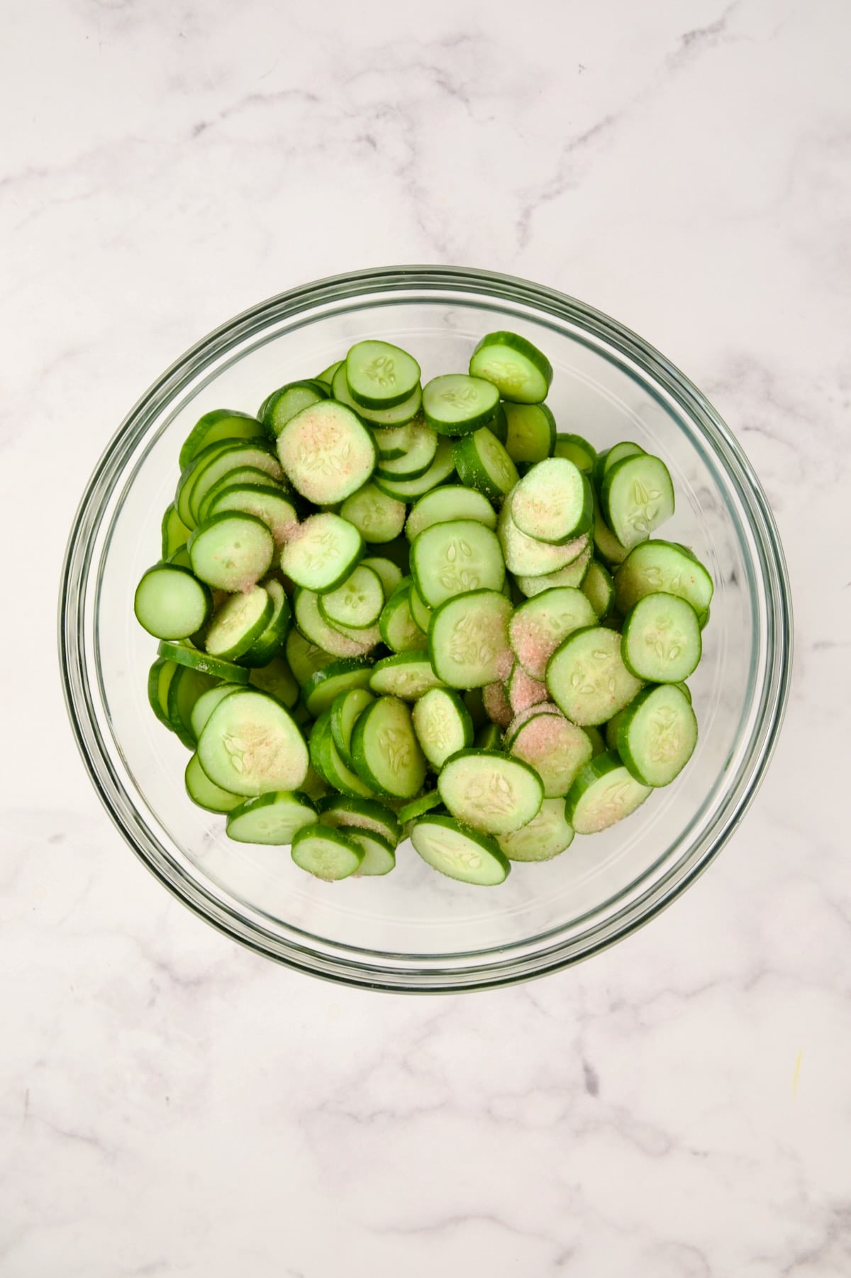Cucumber slices in glass bowl.