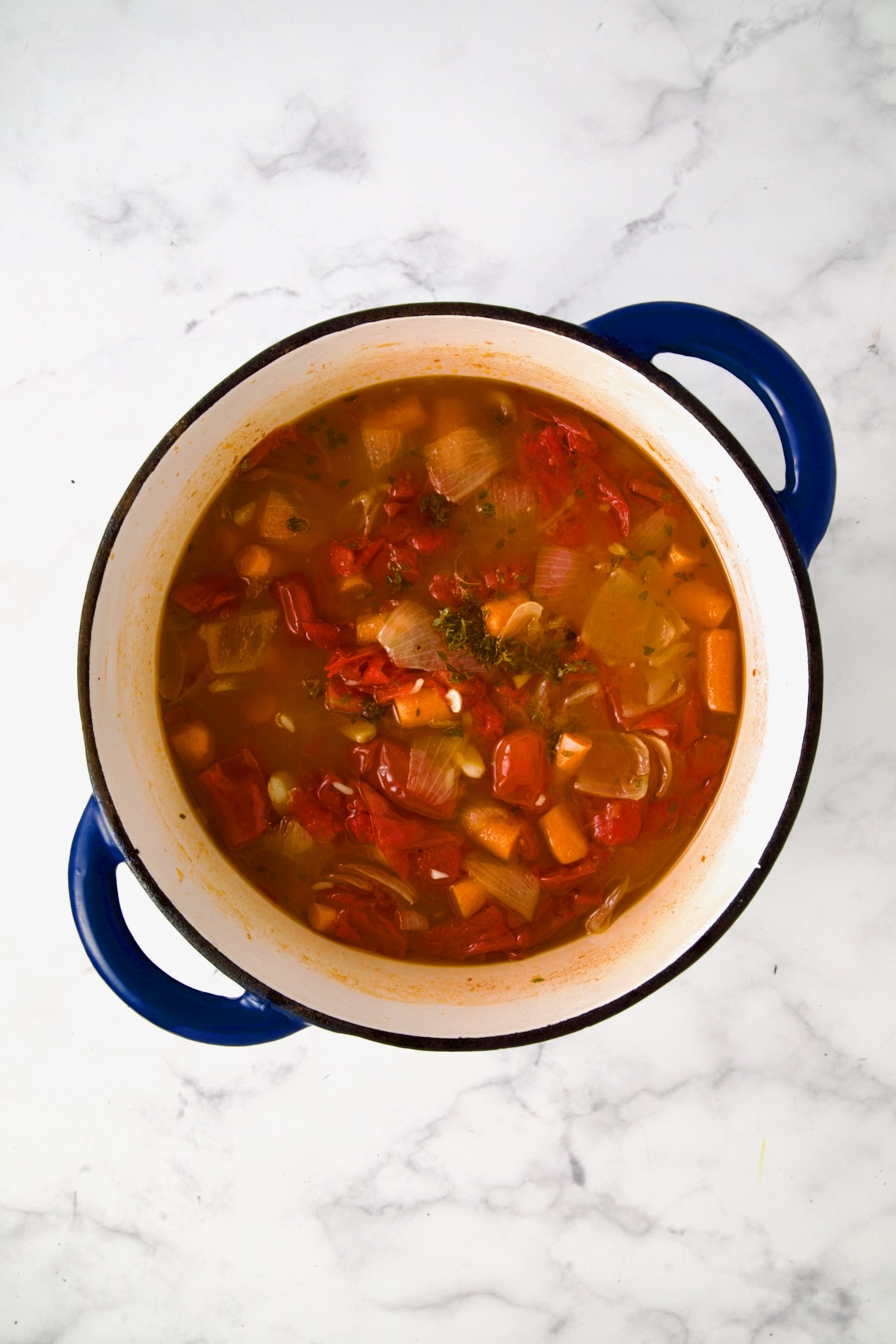 Tomato soup after being simmered and before cream is added.