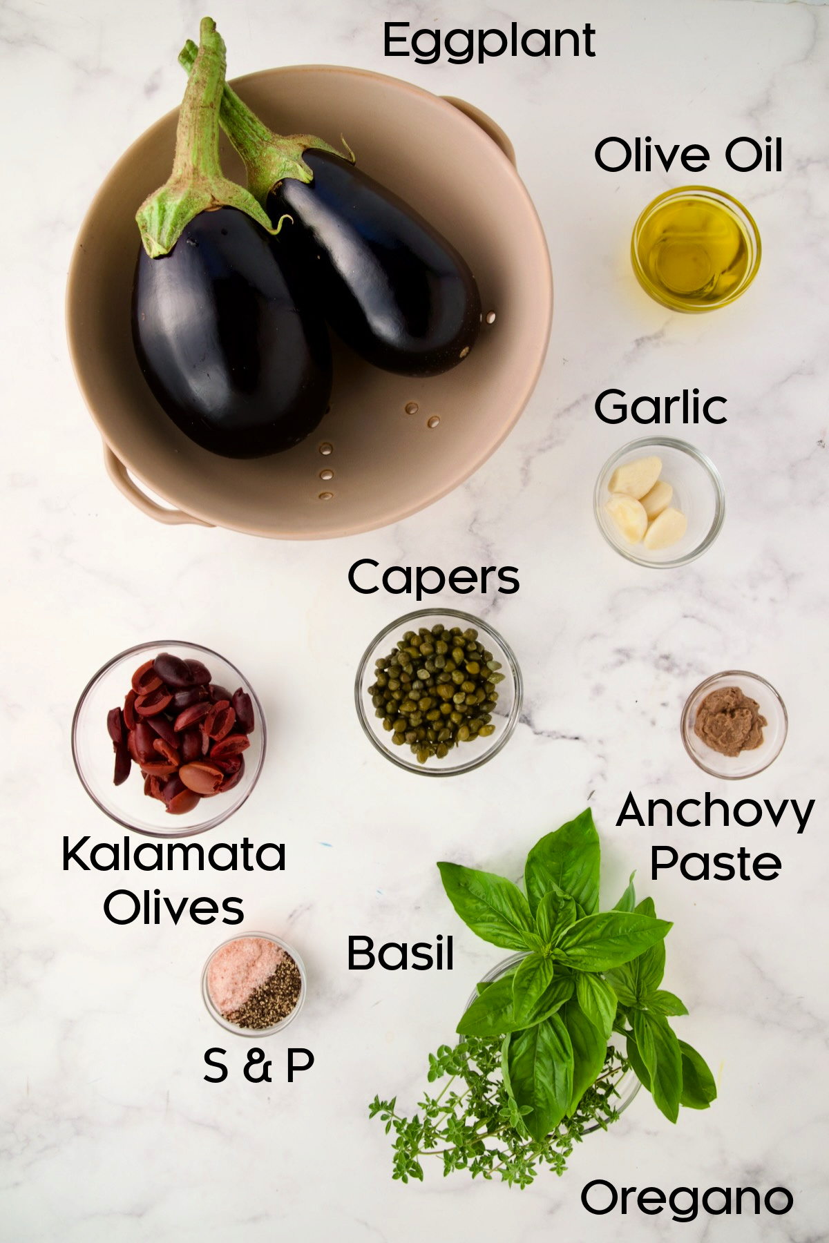 Ingredients for Eggplant Caviar in glass bowls.