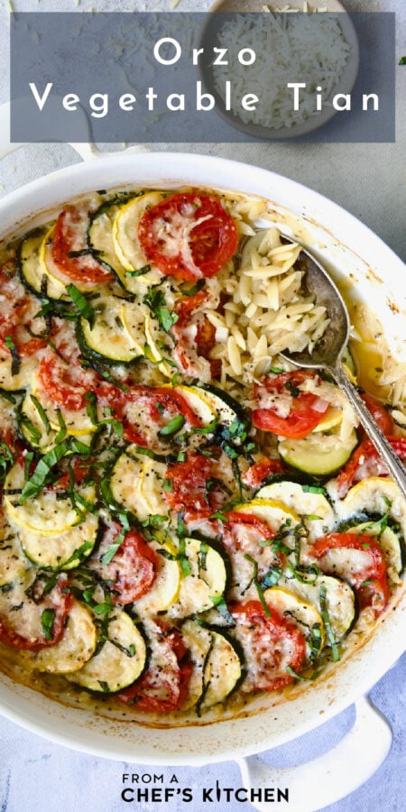 Pinterest graphic for Orzo Vegetable Tian showing it in a round white baking dish.