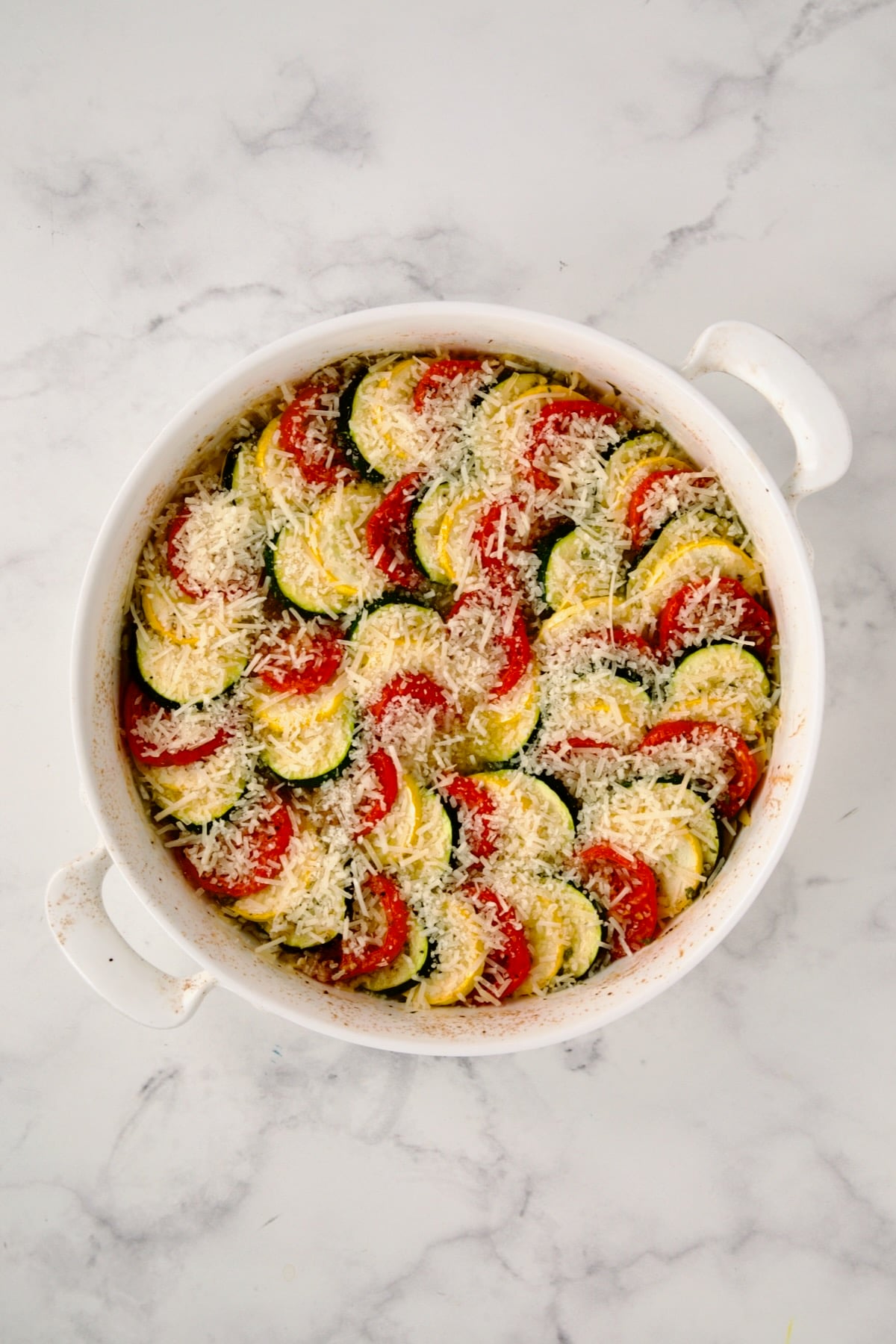 Parmesan cheese added to tian before being broiled.