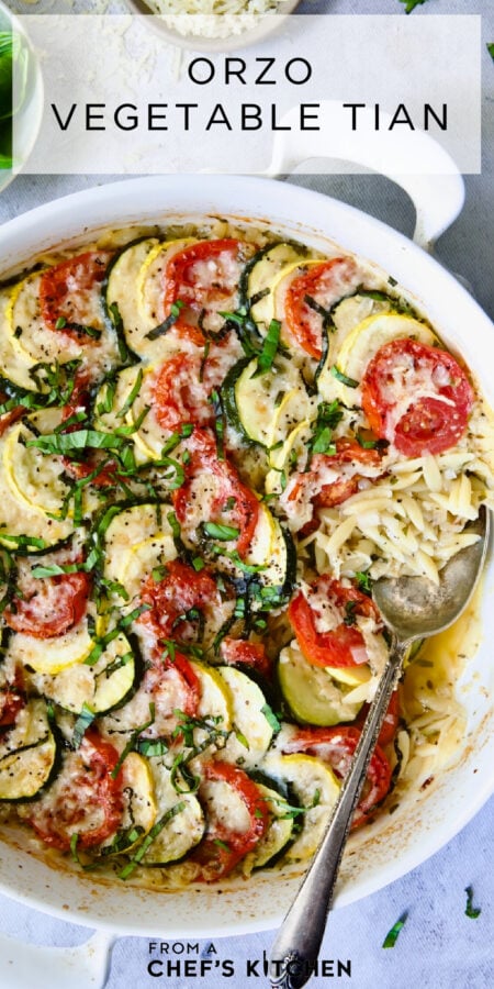 Pinterest graphic for Orzo Vegetable Tian showing it in a round white baking dish.